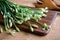 Garlic chives or Allium tuberosum on wooden table