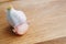 Garlic clove and garlic bulb on wooden table, copy space. Spices