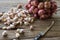 Garlic cloves and Shallots and knife