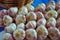 Garlic folded into bundles lined on the counter.