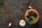 Garlic and Fragrant Herbs on Dark Marble Background Top View