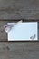 garlic and garlic cloves on a white sheet with space for writing on a wooden background