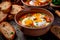 Garlic Lover\\\'s Delight: Sopa de Ajo, a Wholesome Soup Infused with Bread, Paprika, and Poached Eggs