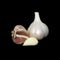 Garlic onion and peeled clove isolated on black background