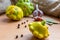 Garlic, peppercorns and squash on a wooden kitchen board