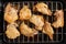 Garlic roast chicken in oven on wooden background