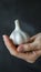 Garlic selection hand holding garlic bulb with copy space on blurred background