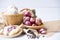 Garlic,shallot,Black pepper, fresh garlic, garlic clove, garlic bulb and shallot in a wooden basket on white wooden table, A herb