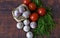 Garlic in a small wicker basket, tomatoes and dill