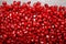 Garnet background. Pomegranate background. Juicy red pomegranate seeds. Natural fruity ingredients for healthy juices.