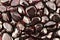 Garnet heap stones texture on black background