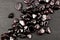 Garnet heap up stones texture on black stone background