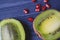 Garnet and kiwi fruits on the table. Healthy food. Useful fruits.
