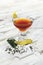 Garnished cocktail on white background