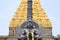 Garuda, the vehicle of the Hindu god Vishnu facing the Chennakesava temple, Belur, Karnataka. East Gopura, tower over entrance, is