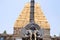 Garuda, the vehicle of the Hindu god Vishnu facing the Chennakesava temple, Belur, Karnataka. East Gopura, tower over entrance, is