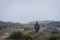 Garut, Indonesia - August 12, 2018 : A man are enjoying and hiking Papandayan Mountain. Papandayan Mountain is one of the favorite