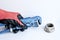 Gas adjustable wrench in a man`s hand in a red working glove. Locksmith tool