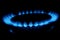 Gas cooker with burning fire propane gas. Blue flames on gas stove burner isolated on black background