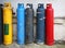 Gas cylinder. Industrial propane butane bombs. Row dirty gas cylinders.