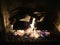 A gas fireplace burning in the evening