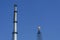 Gas flares in petroleum refinery with blue sky background