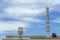 Gas flares in petroleum refinery  with blue sky background