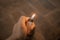 A gas-fueled lighter against a wooden table as a background