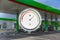 Gas station with fuel gauge for cars. Refill green in blur. Blurred photo for background