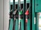 Gas Station Pumps. Modern Service Station. A service concept. Colorful Petrol pump filling nozzles. Green submachine gun. Multi-