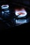 Gas stove at home, natural propane gas burns on dark background with black copy space