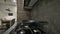 Gas stove top at modern dark brown, gray and black kitchen