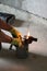 Gasoline blowtorch with a burning fire, the use of a blowtorch in construction.