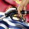 Gasoline consumption concept - Hand holding hose against flag of Kiribati