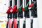 Gasoline and diesel distributor at the gas station. Gas pump nozzles. Petrol filling gun close-up at the gas station. Colorful Pet