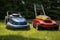 gasoline and electric lawn mowers side by side