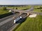 Gasoline truck Oil trailer on highway driving along the road. aerial view of Tank vehicle at work