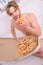 Gastronomic satisfaction. Man bearded handsome eat pizza. Man eat pizza breakfast. Guy naked covered pizza box sit bed