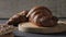 Gastronomic session of bakery, pastry. a croissant spins in the foreground, next to another croissant and other pastries