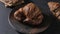 Gastronomic session of bakery, pastry. a croissant spins in the foreground, next to another croissant and other pastries