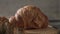 Gastronomic session of bakery, pastry. a croissant spins in the foreground, next to another croissant and other pastries