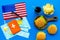 Gastronomical tourism with american flag, passport, tickets, map, burgers, chips, drink on blue background top view