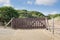 A gate blocks access to the dunes.