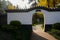 Gate of bonsai garden in sunny winter morning