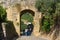 Gate in city wall of Castle of Monteriggioni. Tuscany. Italy