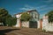 Gate and cottage amidst trees near Elvas