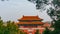 Gate of Divine Might Shenwumen, the northern gate of Forbidden Palace, among trees, in Beijing, China