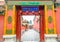 The gate door of red wall of Forbidden Palace with stone walking path between 2 buildings or house