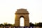 Gate of india arch in new delhi india at sunset with tourists crowd