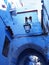 Gate in moroccan alley in Chefchaouen city in Morocco - vertical